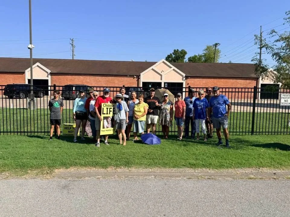 Whiteash Free Will Baptist team on the sidewalk