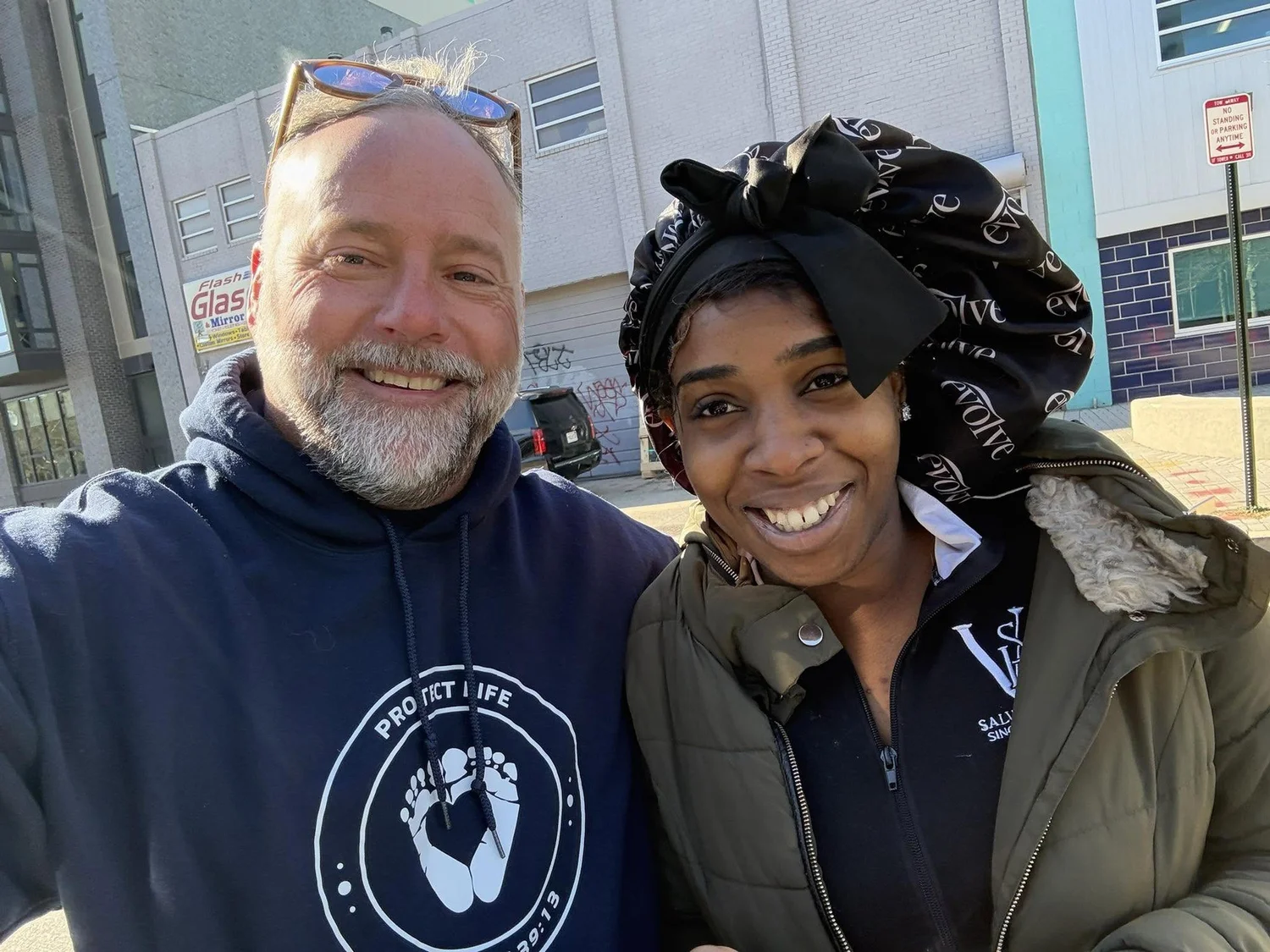Scott with a mom on a DC sidewalk