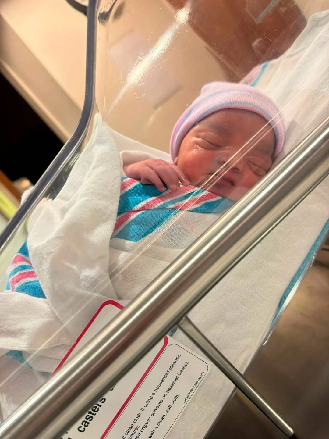 Newborn Jay Scott in a hospital bassinet