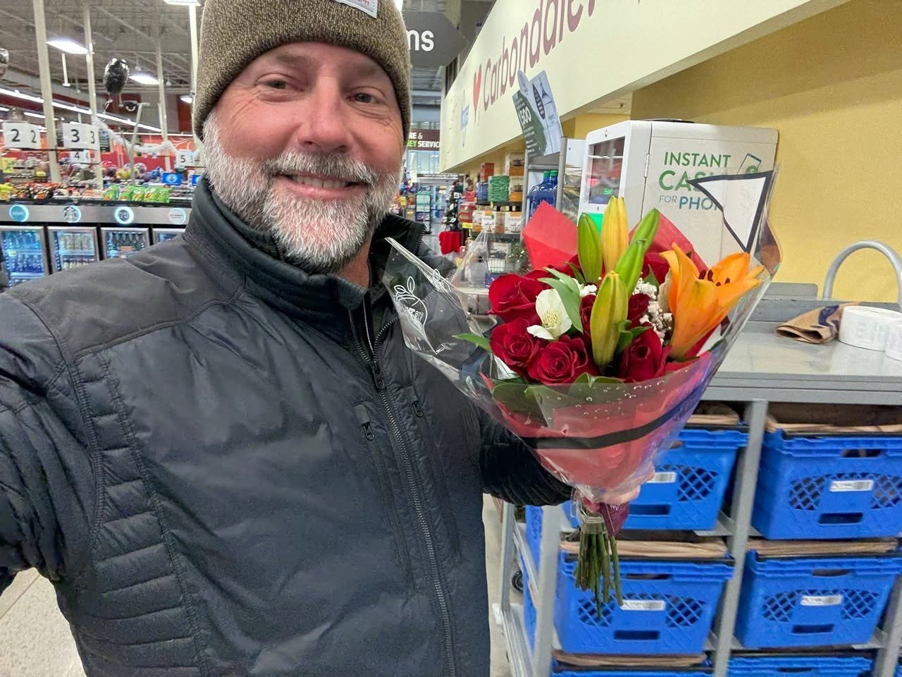 Scott holding a bouquet of flowers