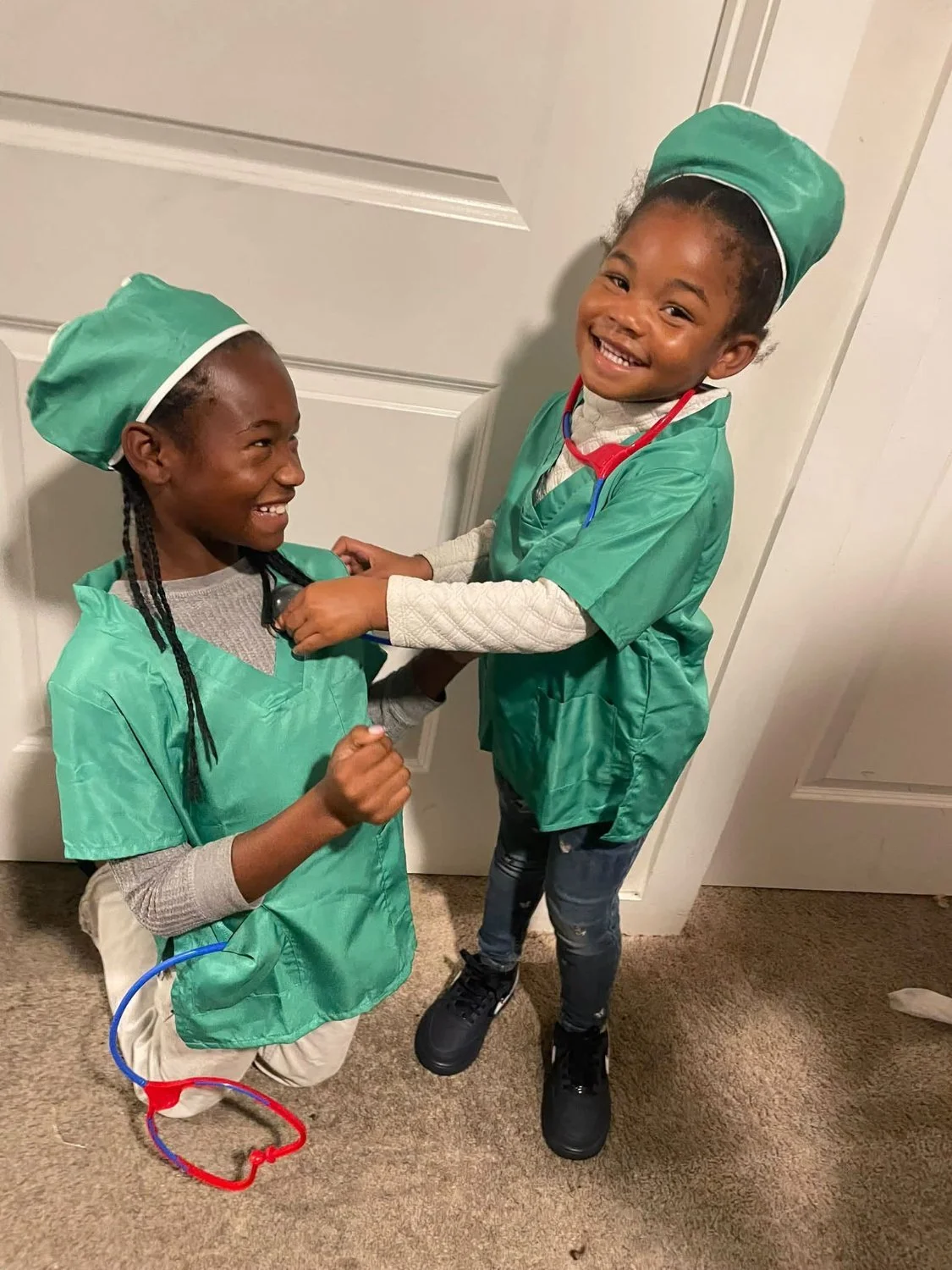 Essence in nurse scrubs on career day