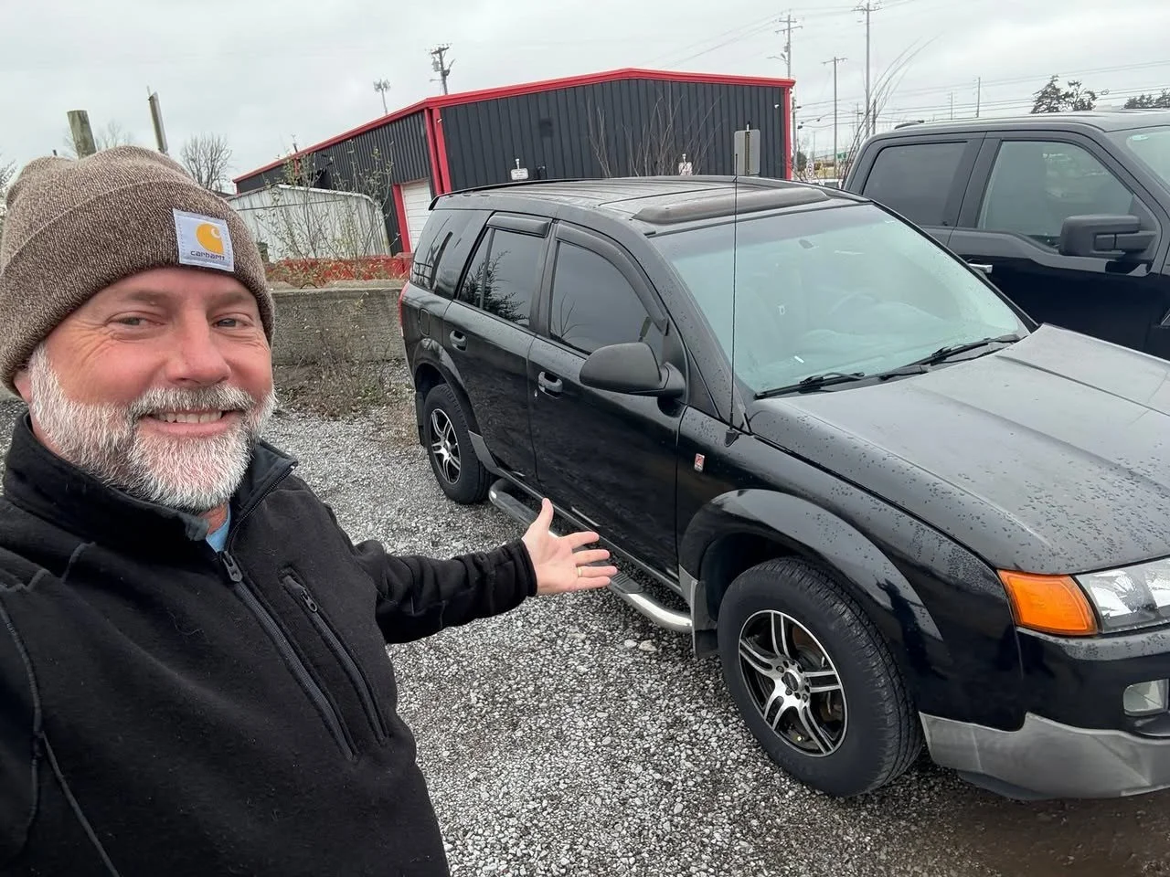 Scott with a car donated for a mom