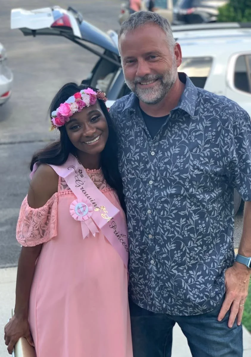 Scott with a mom at her baby shower