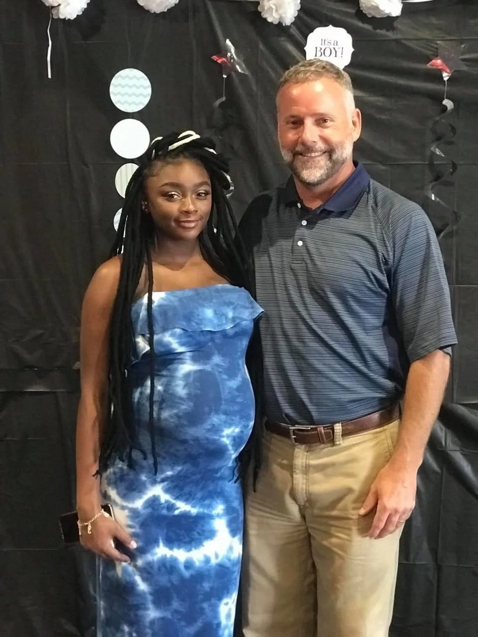 Scott with a mom at a baby shower