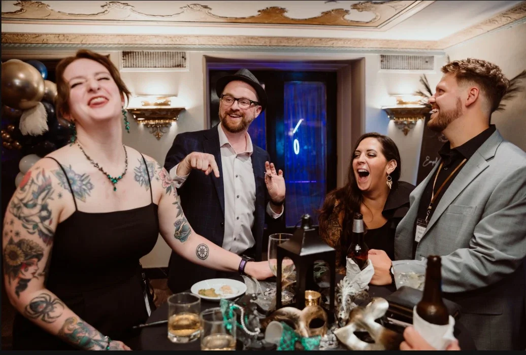 Guests laughing during a private house party magic show