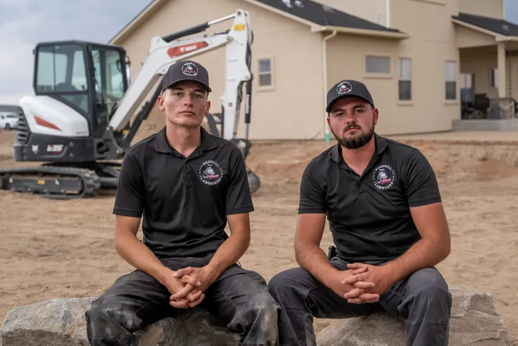 Anthony Heathco and Colton Roush at job site with excavator