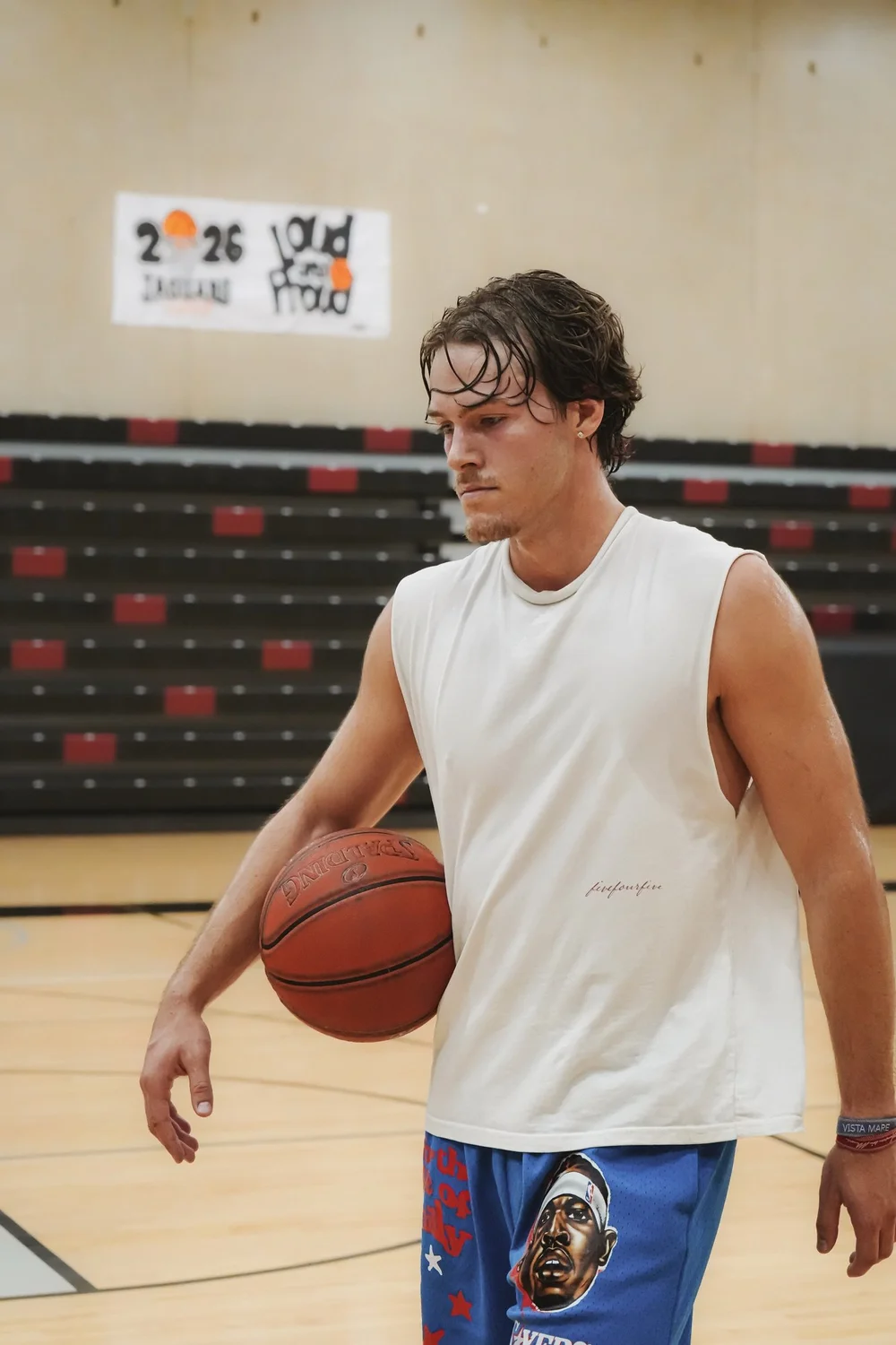 Luca with a basketball at practice