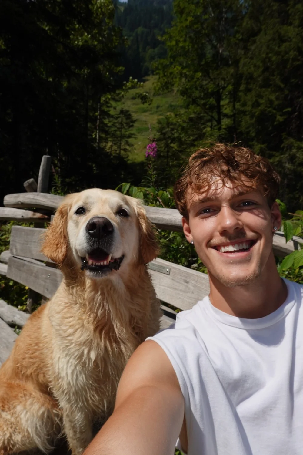 Luca taking a selfie with his dog in the mountains