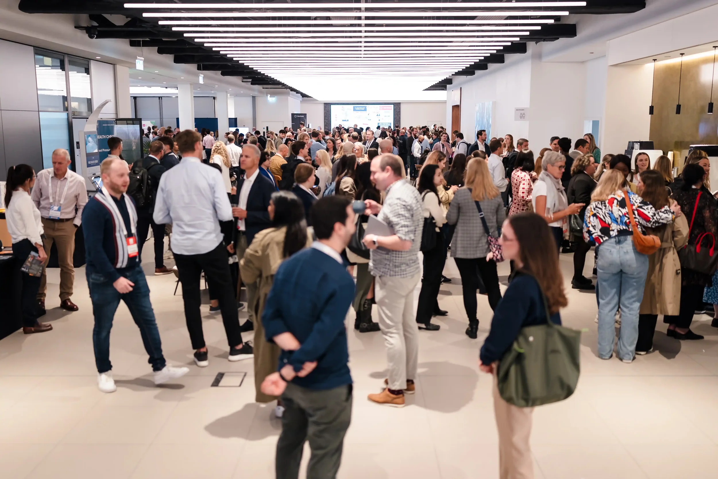 A busy room of people connecting at a People Strategy Hub event