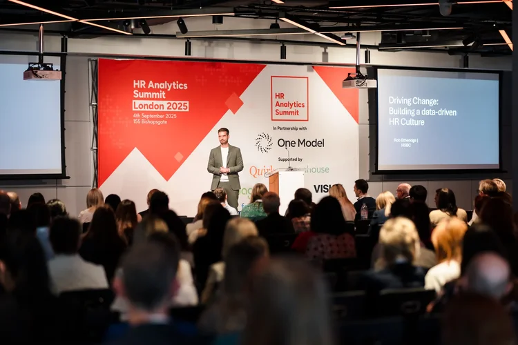 A speaker presenting to a full room at HR Analytics Summit