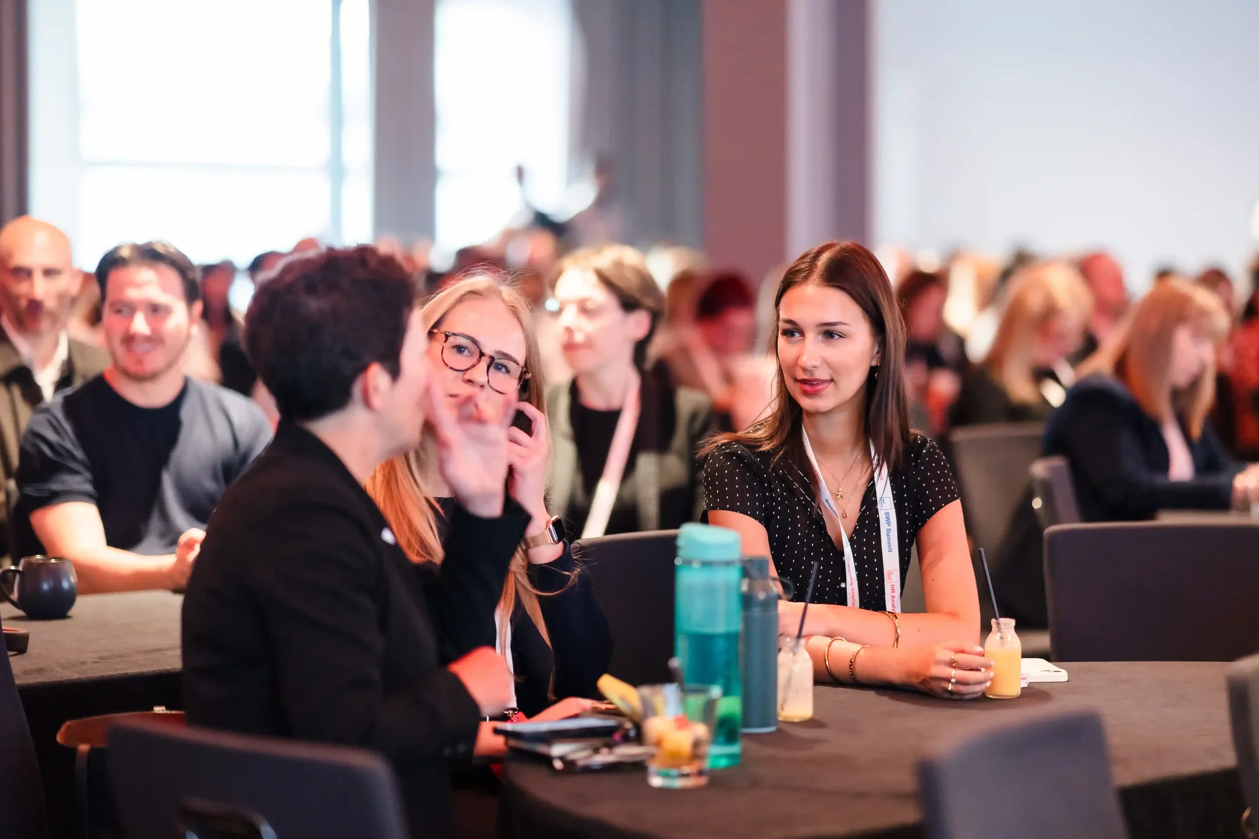 HR Analytics Summit delegates discussing at a table