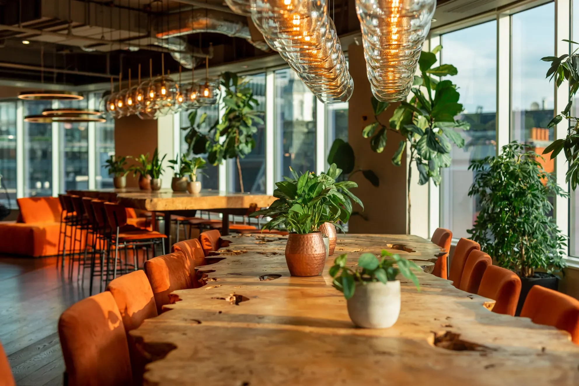 Long communal table and planting at Uncommon Liverpool Street