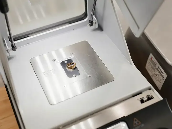 A gold ring inside the XRF analyzer’s test chamber