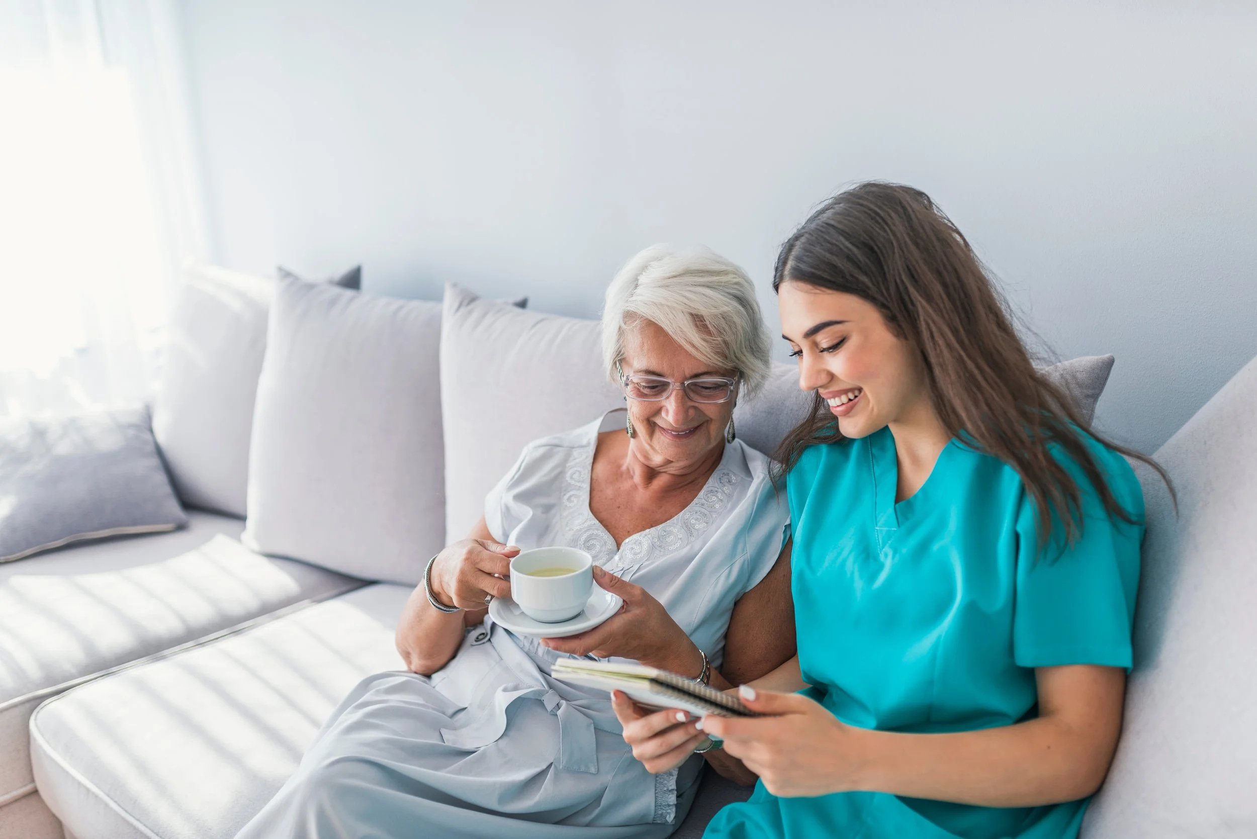 Caregiver providing compassionate support to an older adult at home