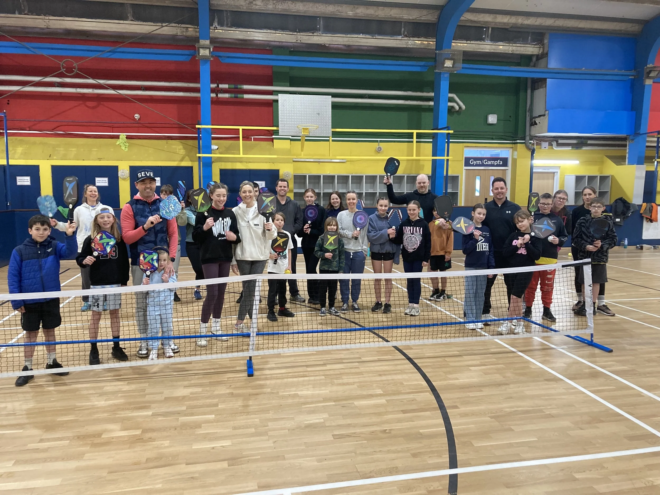 Different generations enjoying pickleball together