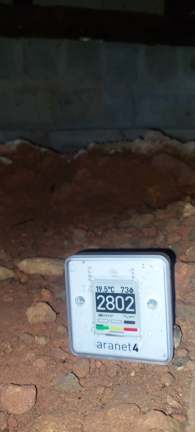 Aranet monitor reading 2,802 ppm CO2 and 73% RH in a subfloor, Joe Builds performance measurement