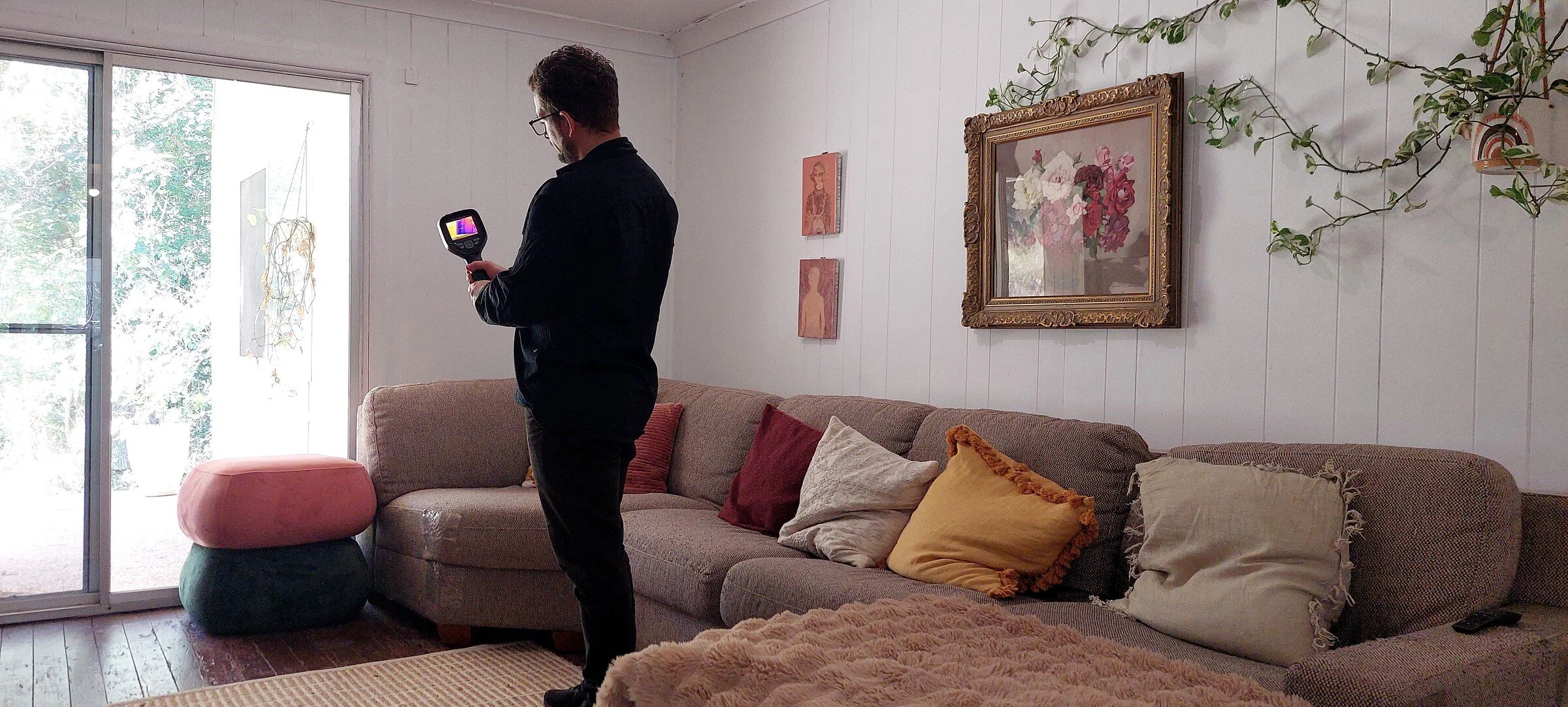 Joe Builds using a thermal camera to record an apparent surface-temperature pattern at an interior window.