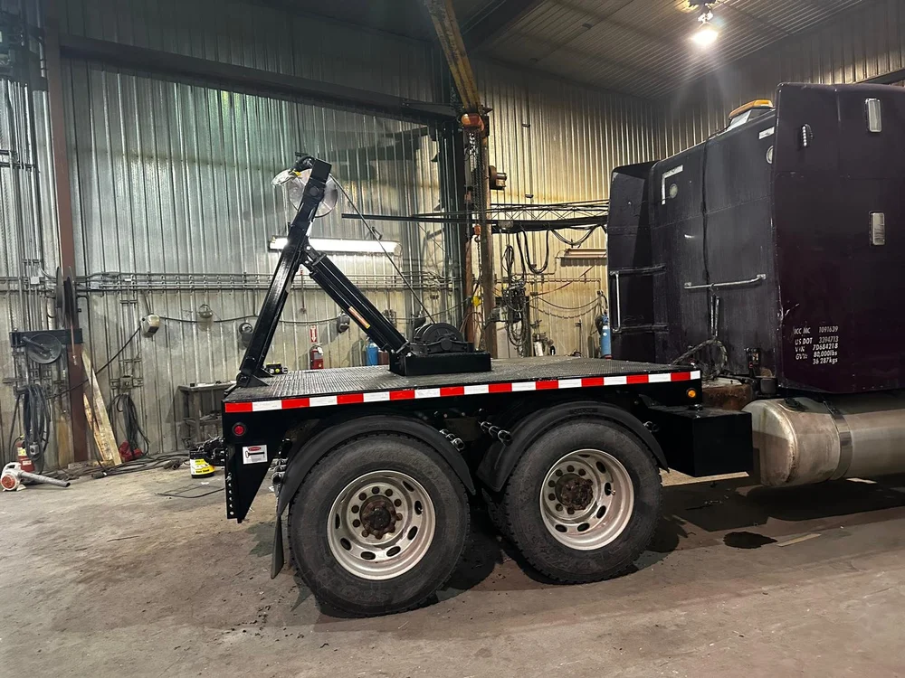 Side view of the truck with its steel lifting frame