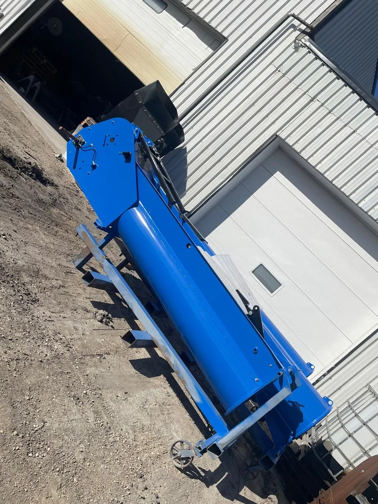 Blue steel grain auger on a steel frame with a wheel