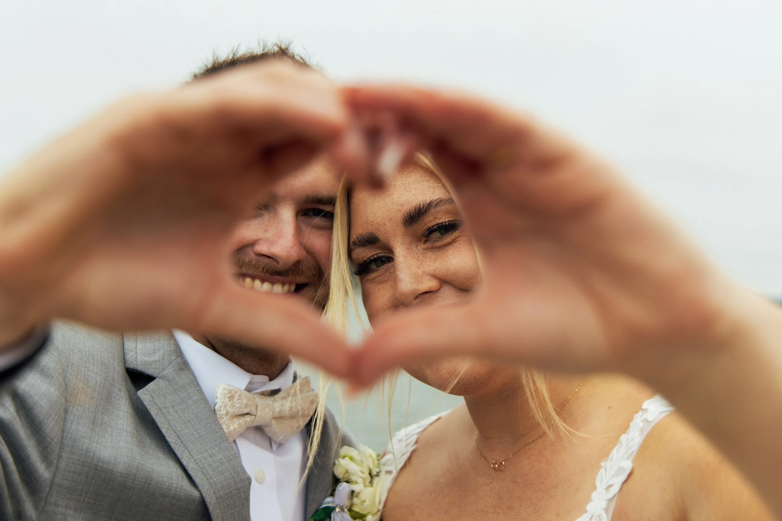 Full-length wedding portrait of Noah and Jenna outdoors