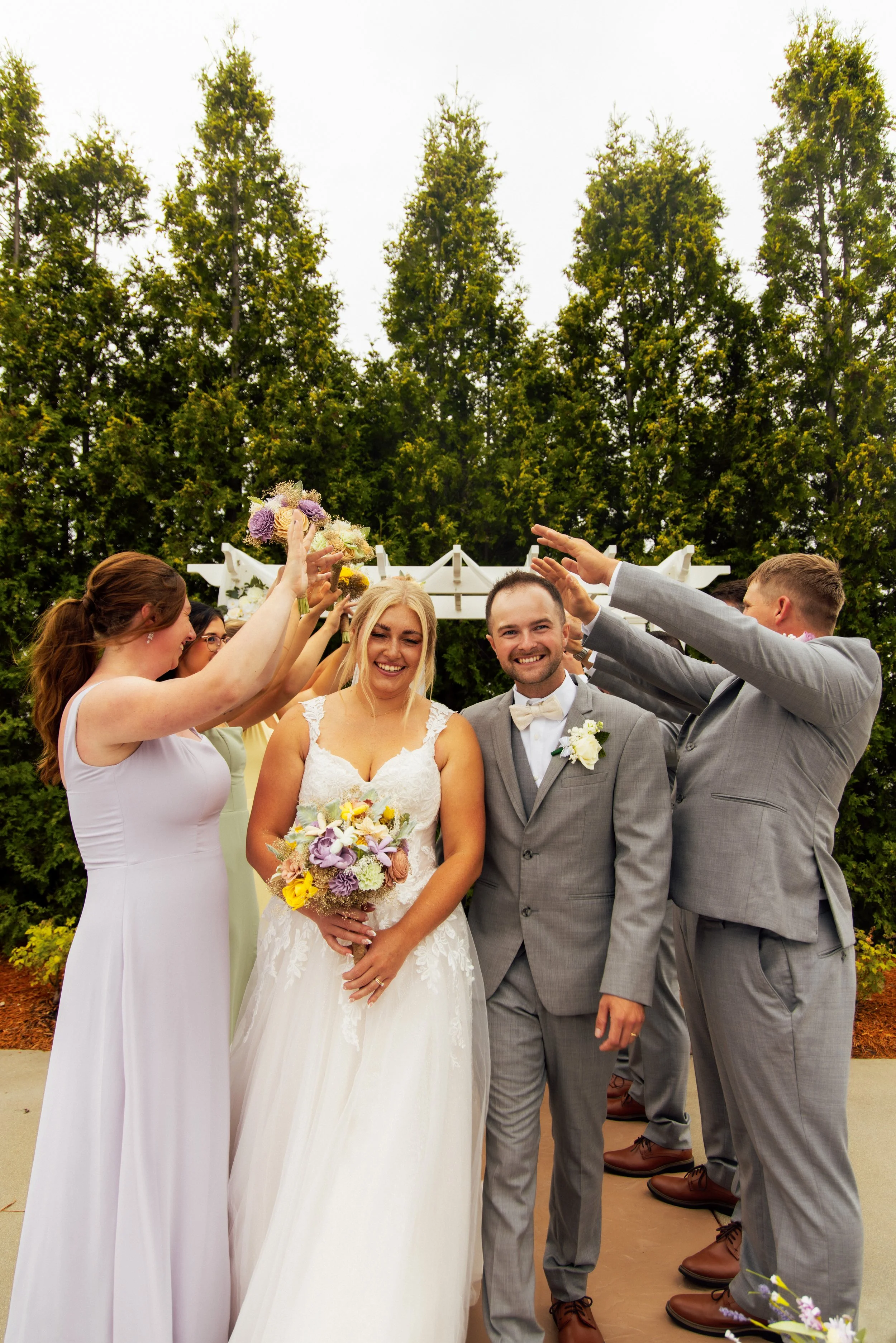 Noah and Jenna celebrating beside the waterfront in Bay City