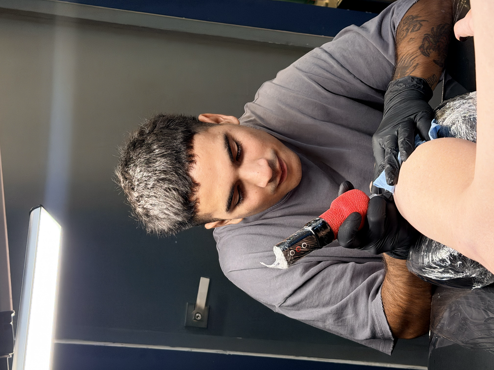 the artist tattooing Andie
