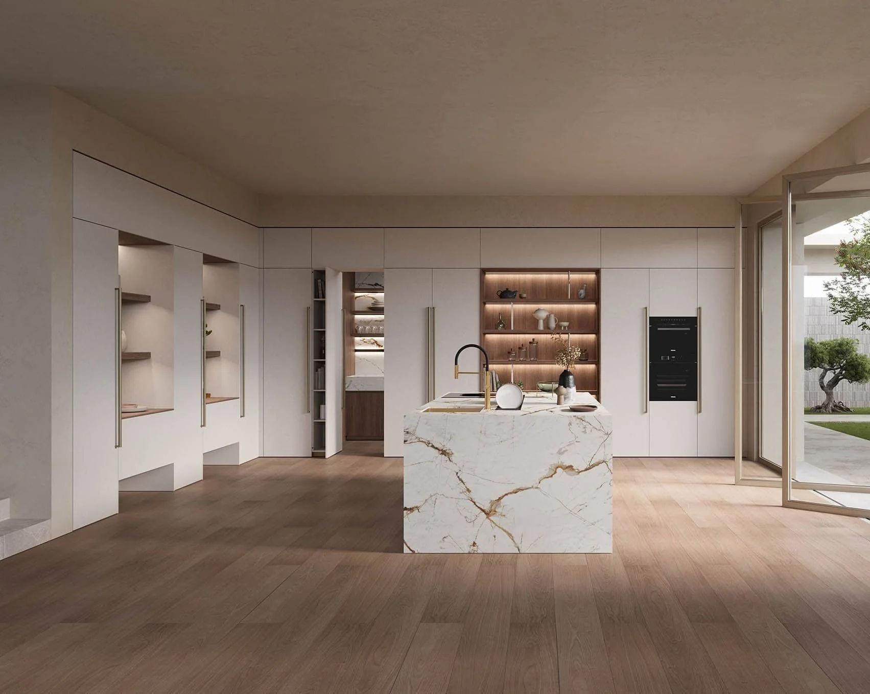TODO, rewrite from the photograph. Drafted from the copy: a handled kitchen with long bronze bar handles running most of the height of each door, a full-height cabinetry run broken by a built-in oven column and a lit open walnut shelving bay, and a stone island with no hardware on the side facing the room.