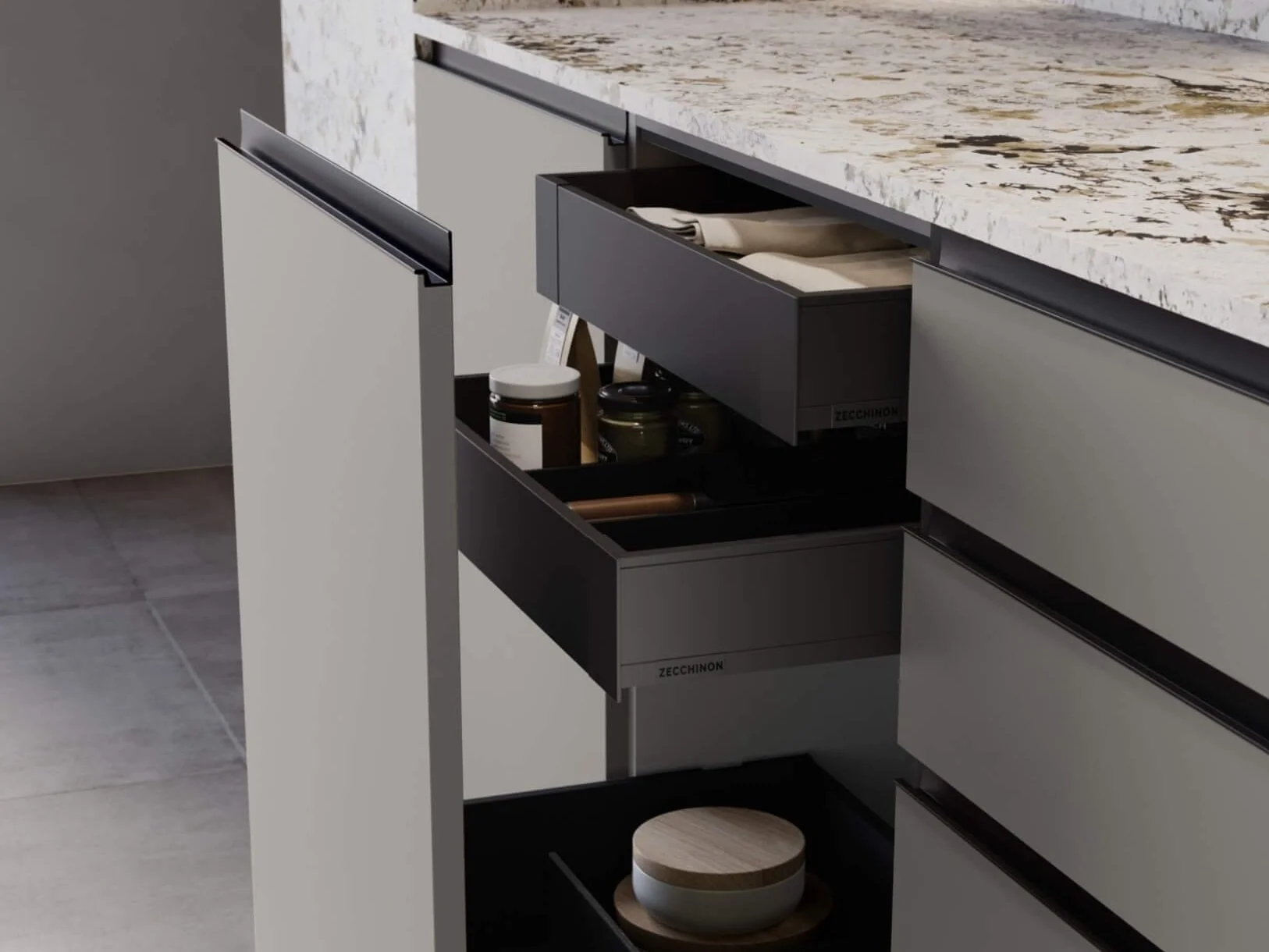 A walnut island with unbroken drawer fronts and no visible handles, set against tall bronze-toned cabinetry.