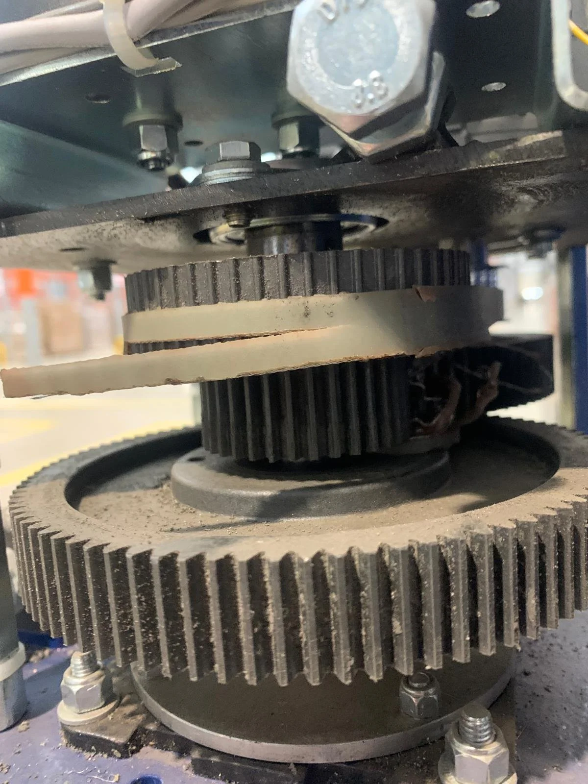 Shredded pallet wrapper drive belt component requiring repair