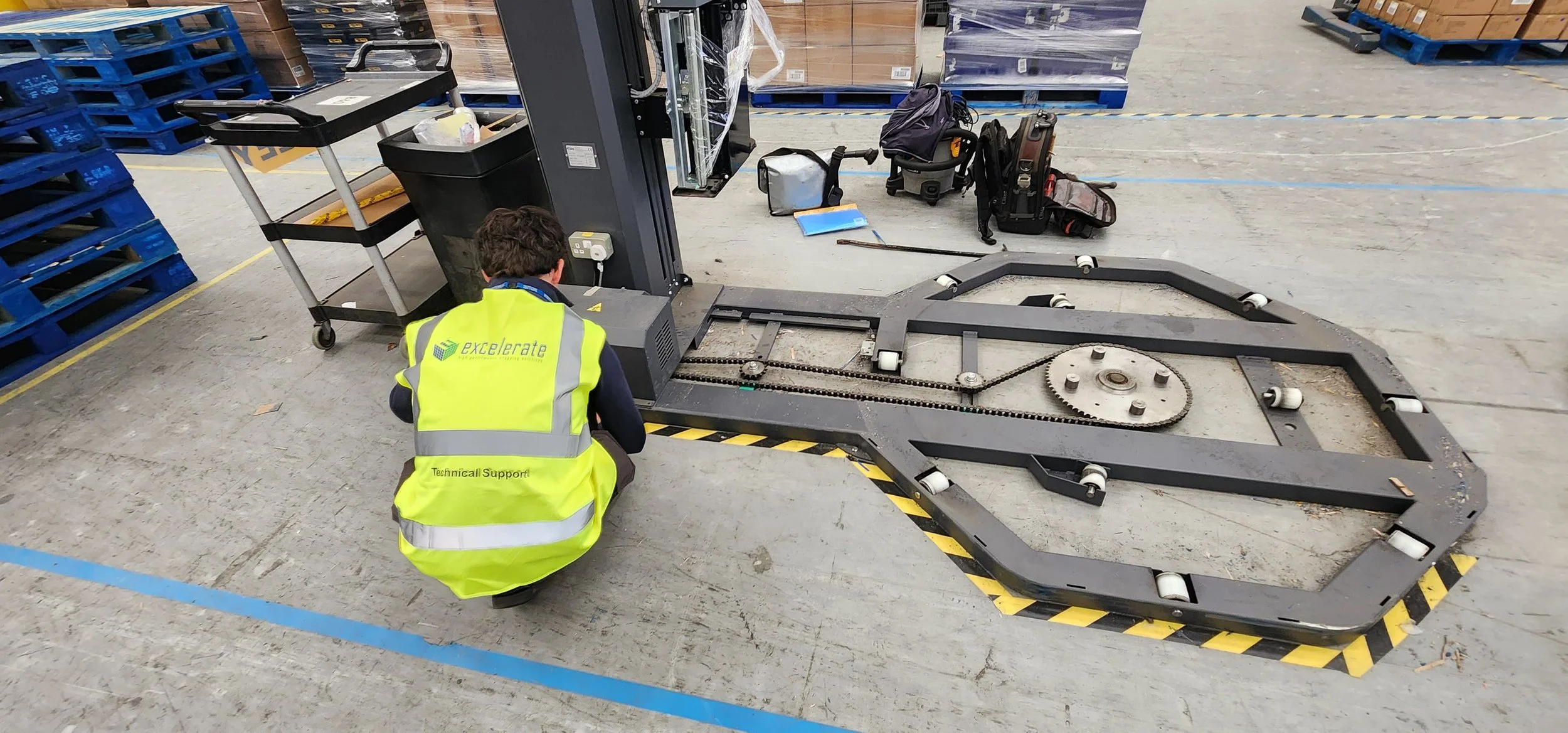 Excelerate engineer repairing pallet wrapper in the UK