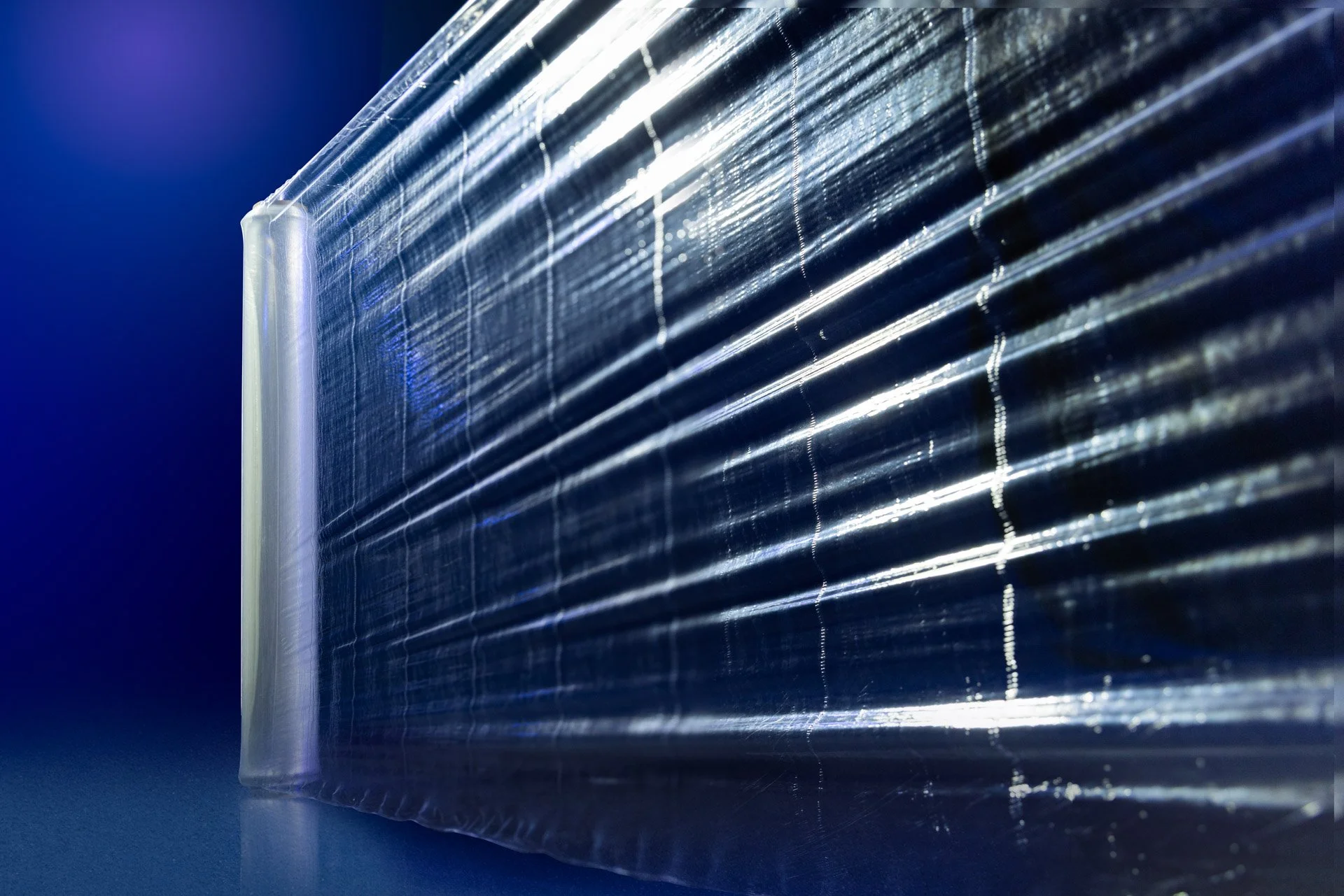 High-strength solid pallet wrap for secure load containment