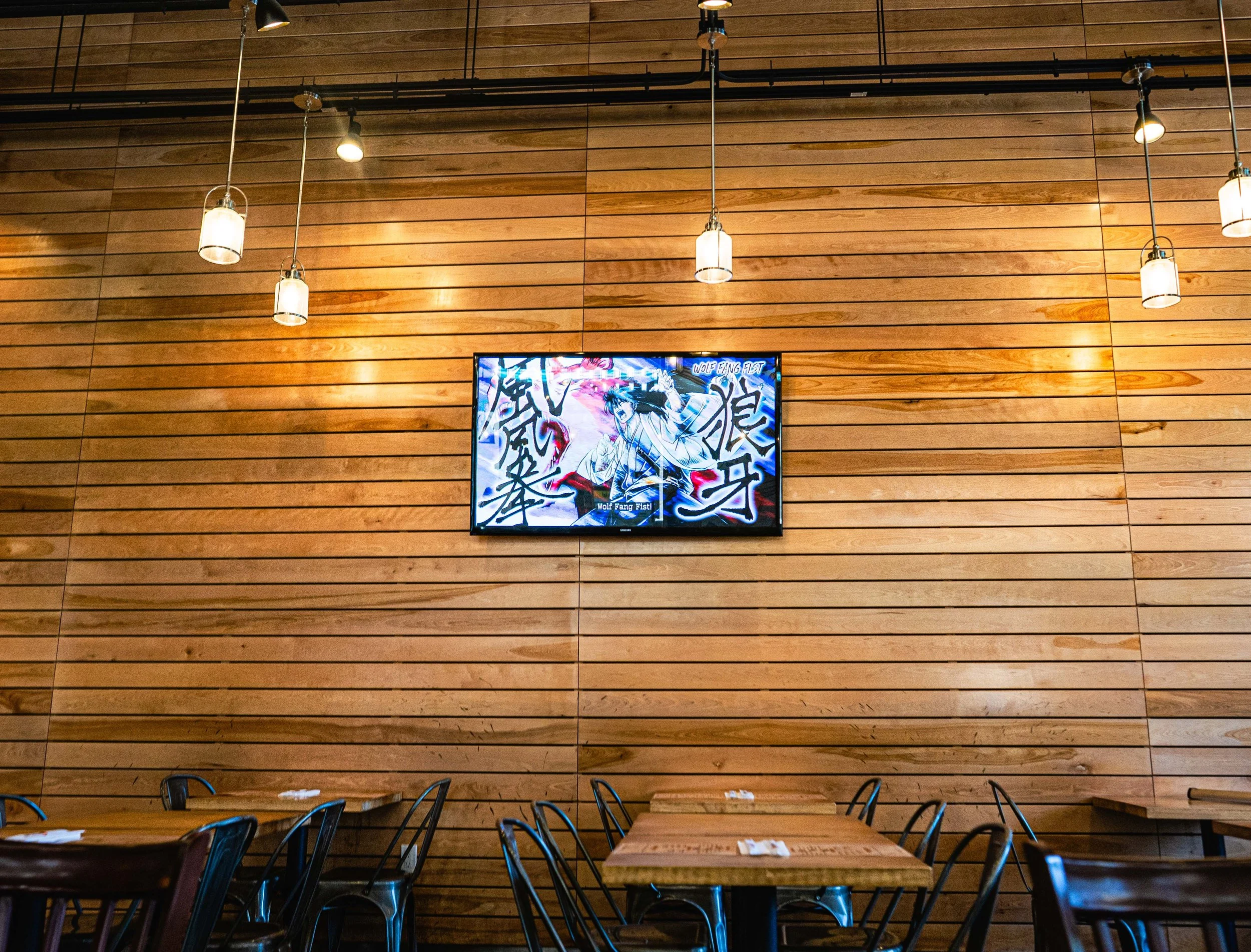 Anime playing on the dining room screen
