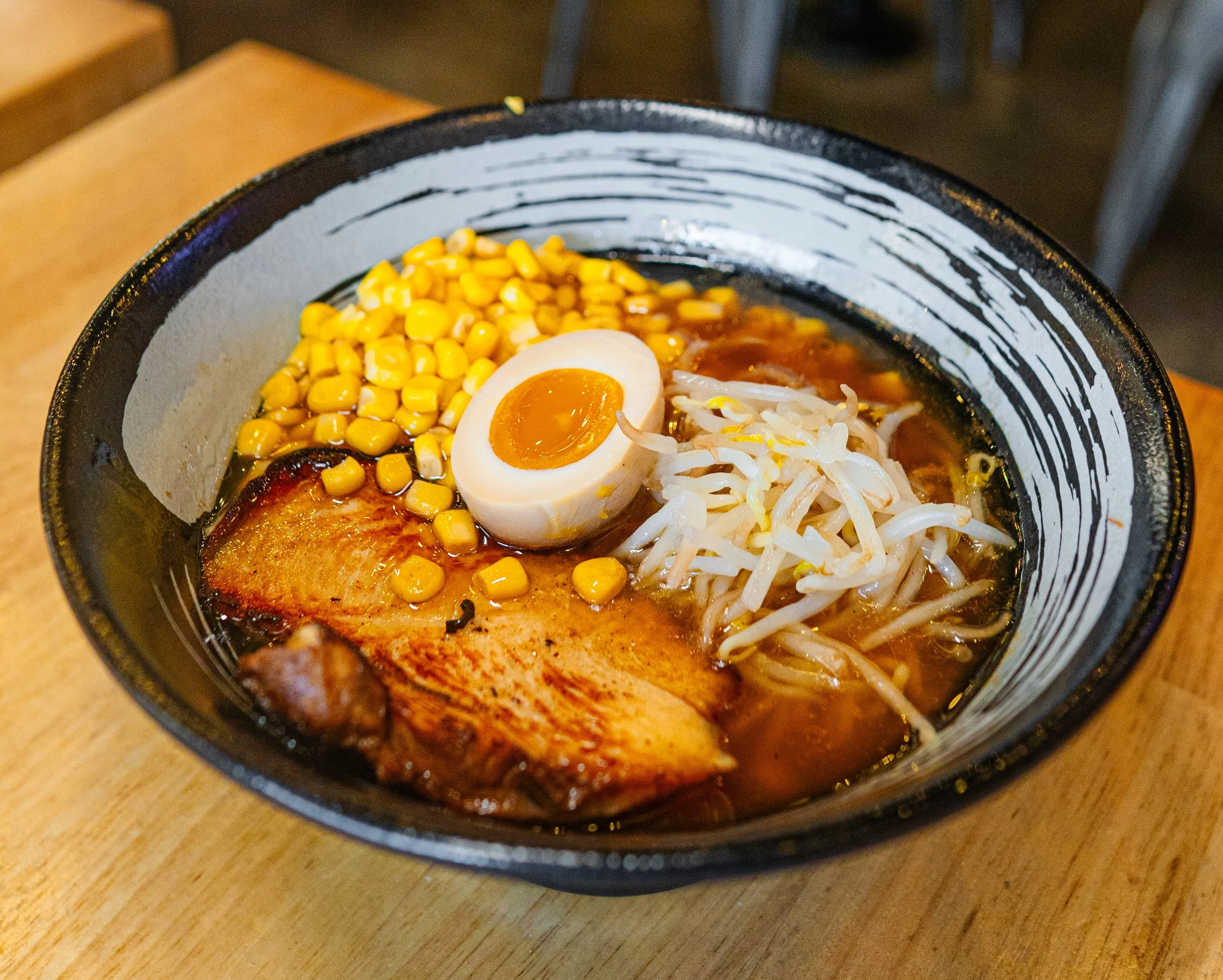 Tokyo Shoyu ramen bowl with chashu, corn and soft-boiled egg