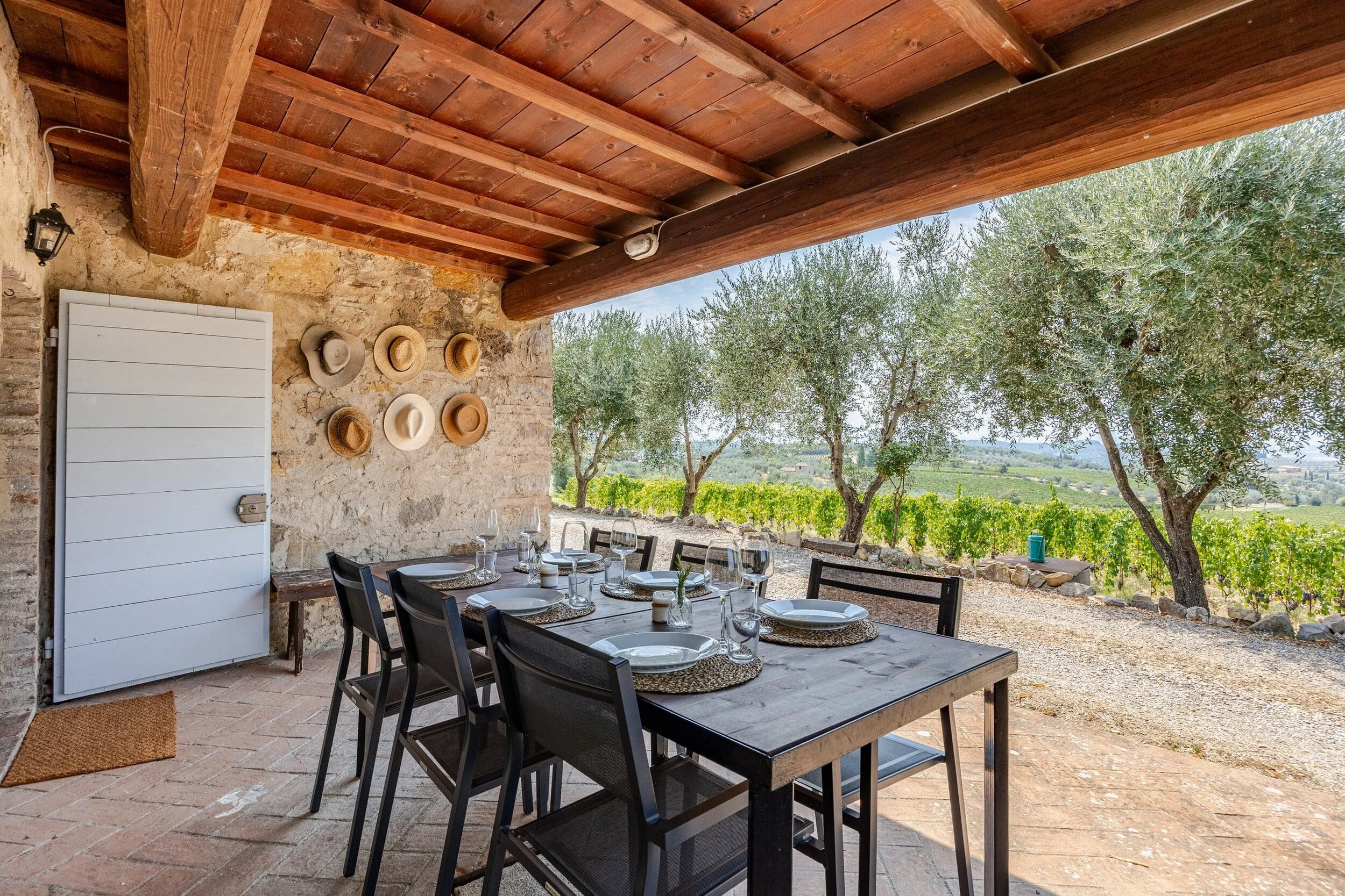 A long outdoor table set for dinner
