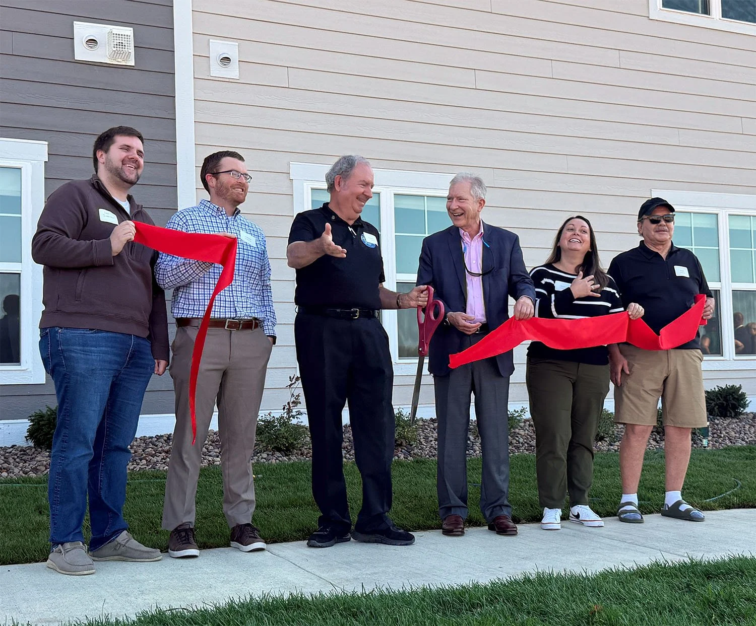Ribbon cutting at a Wangard Partners multifamily community