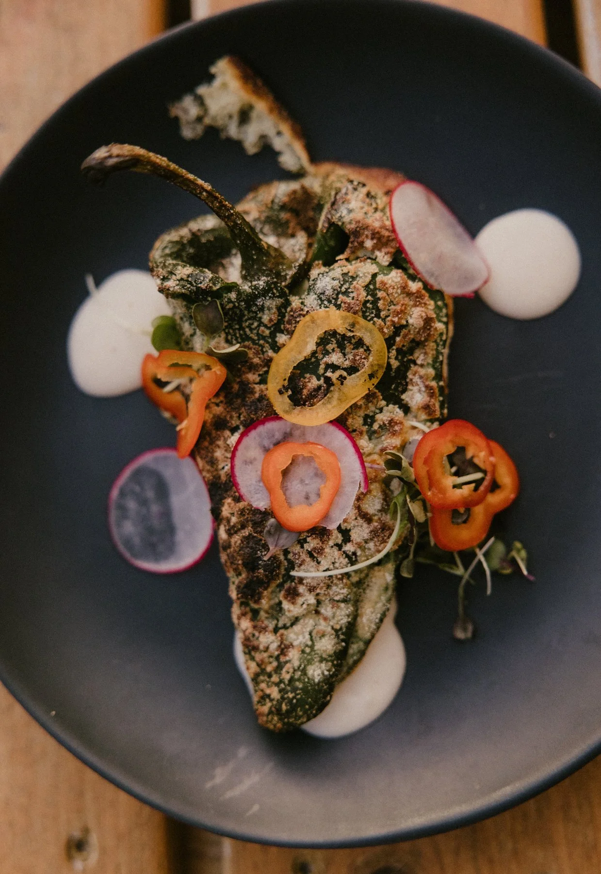 Cheesy Brisket Poblano Relleno with Corn Bisque Sauce by Chef Josh Cervantes at the collaborative Remembering Bourdain dinner at Duett’s.
