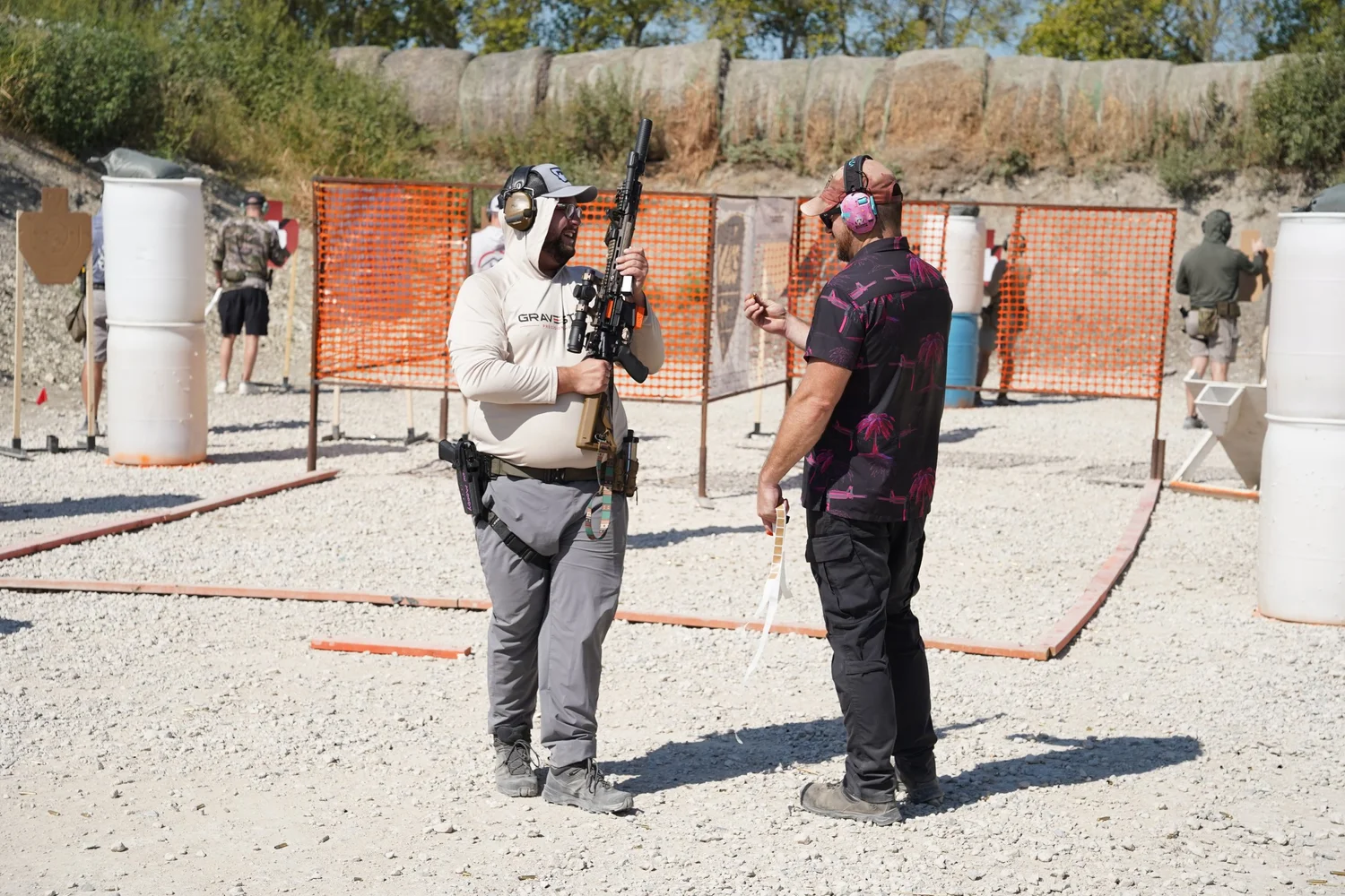 Rifle competitor and range officer at the start position of a PCSL stage at Rooftop Shooting Range in Trenton, TX
