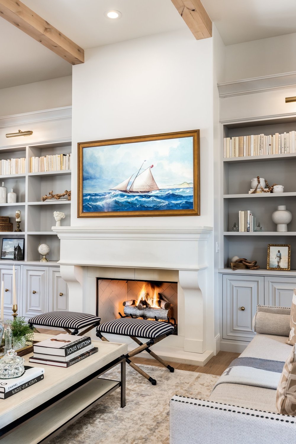Fireplace, bookshelves and exposed ceiling beams in the Sunset property living room