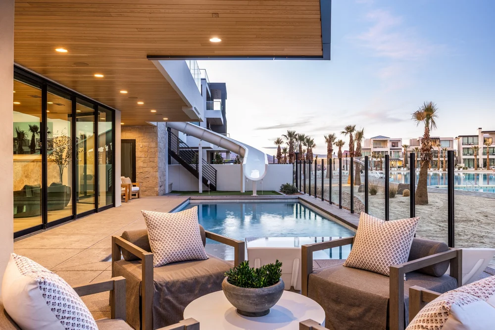 Poolside lounge seating beneath a wood soffit at The Oasis Utah