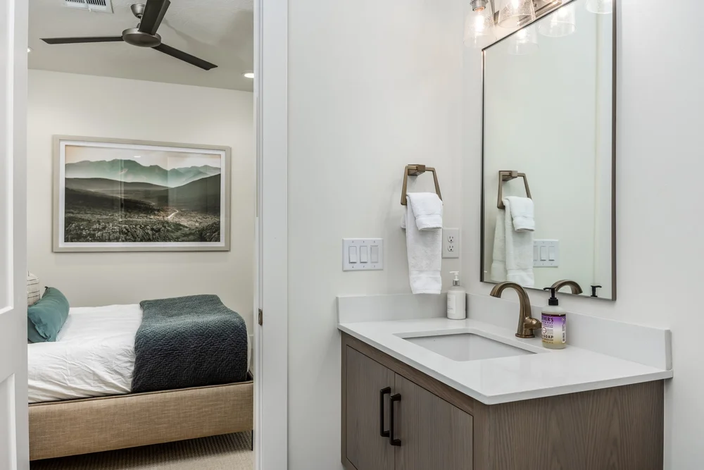 Bathroom vanity adjoining a guest bedroom at Lula Bay