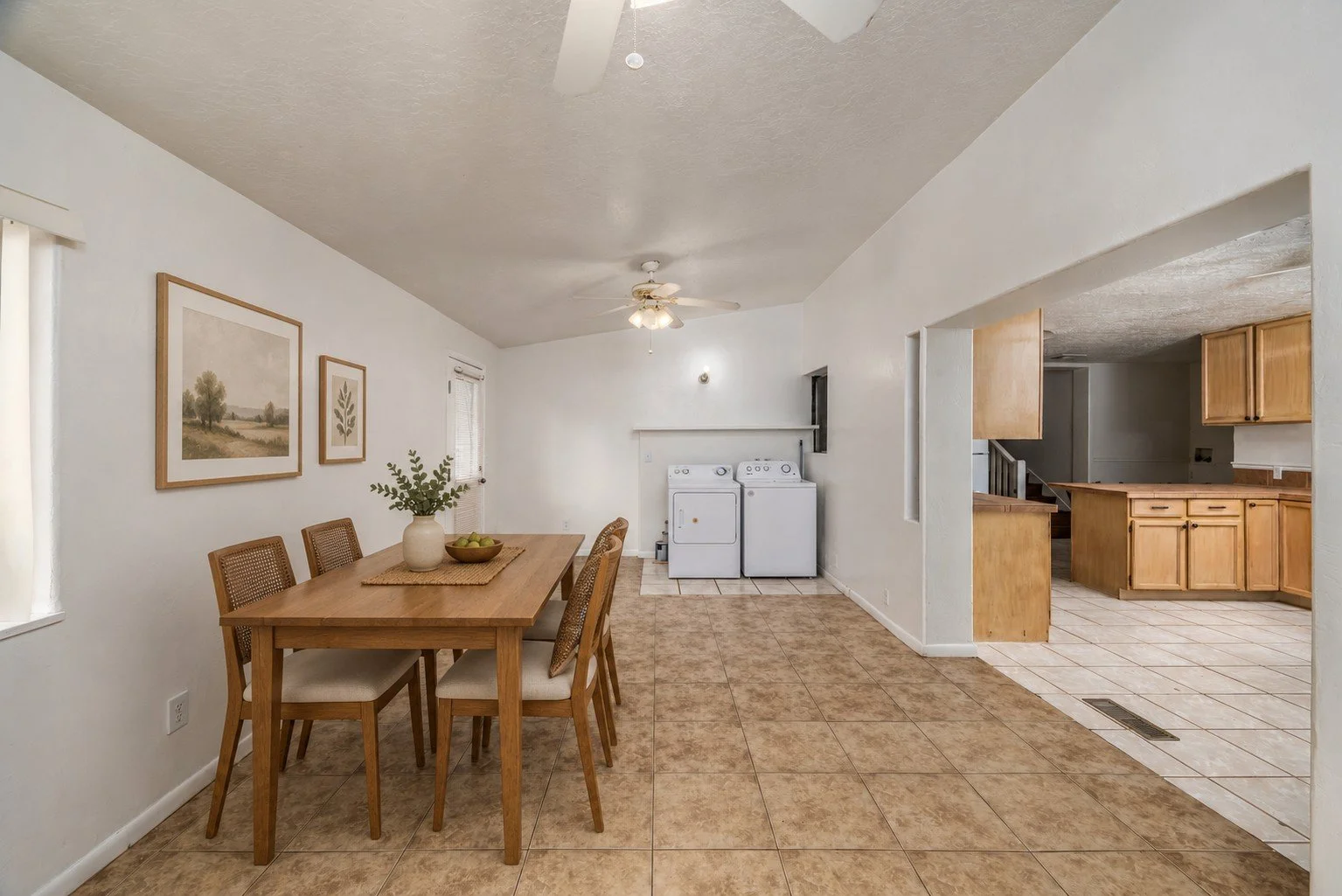 Virtually staged dining area with digitally added furniture and decor