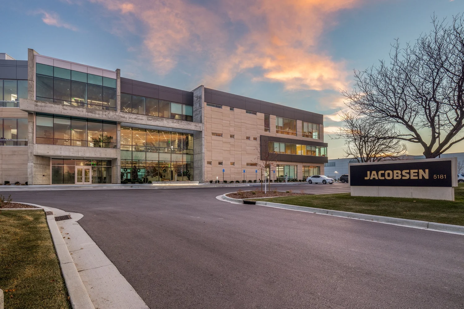 Jacobsen headquarters exterior beneath a warm sunset sky.