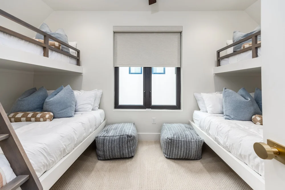 Vacation rental bedroom with twin beds and neutral decor