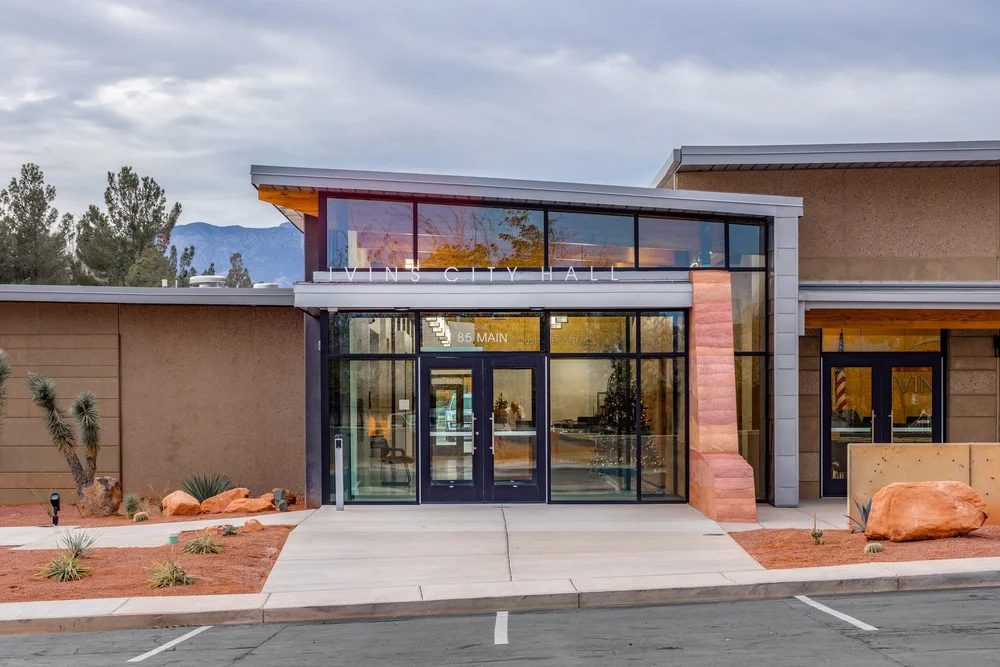 Front entrance of Ivins City Hall framed by desert landscaping.