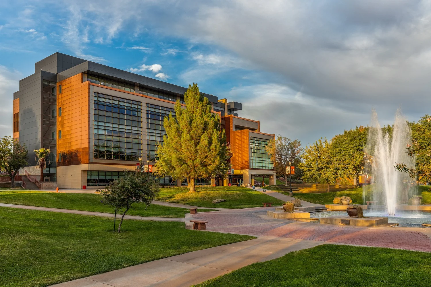 Utah Tech SET building and campus fountain in warm evening light.