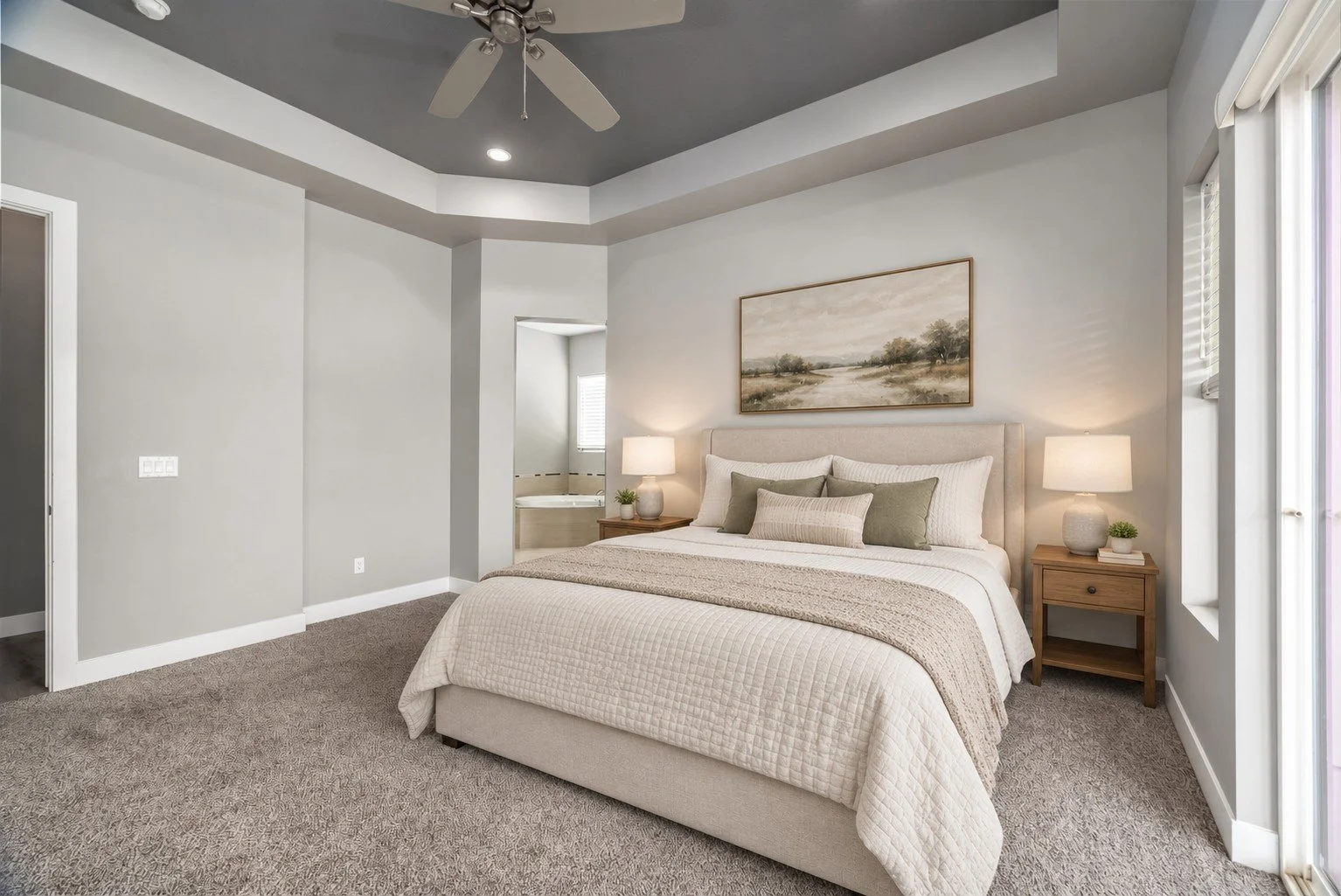 Virtually staged primary bedroom with digitally added furniture and decor