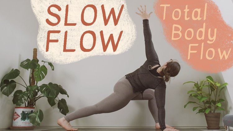 Oceana demonstrates a simple high lunge twist for the thumbnail of her Total Body Flow YouTube video.