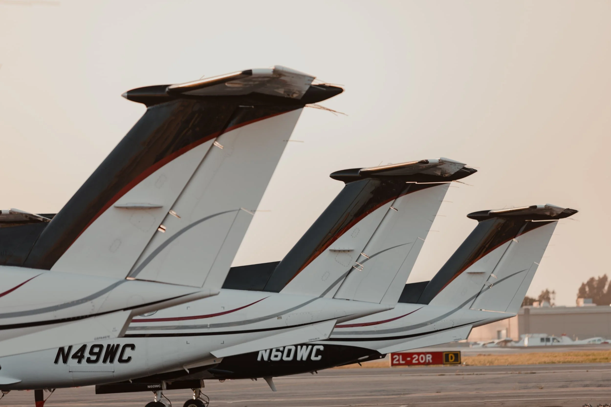 Tails of WCAS aircraft lined up