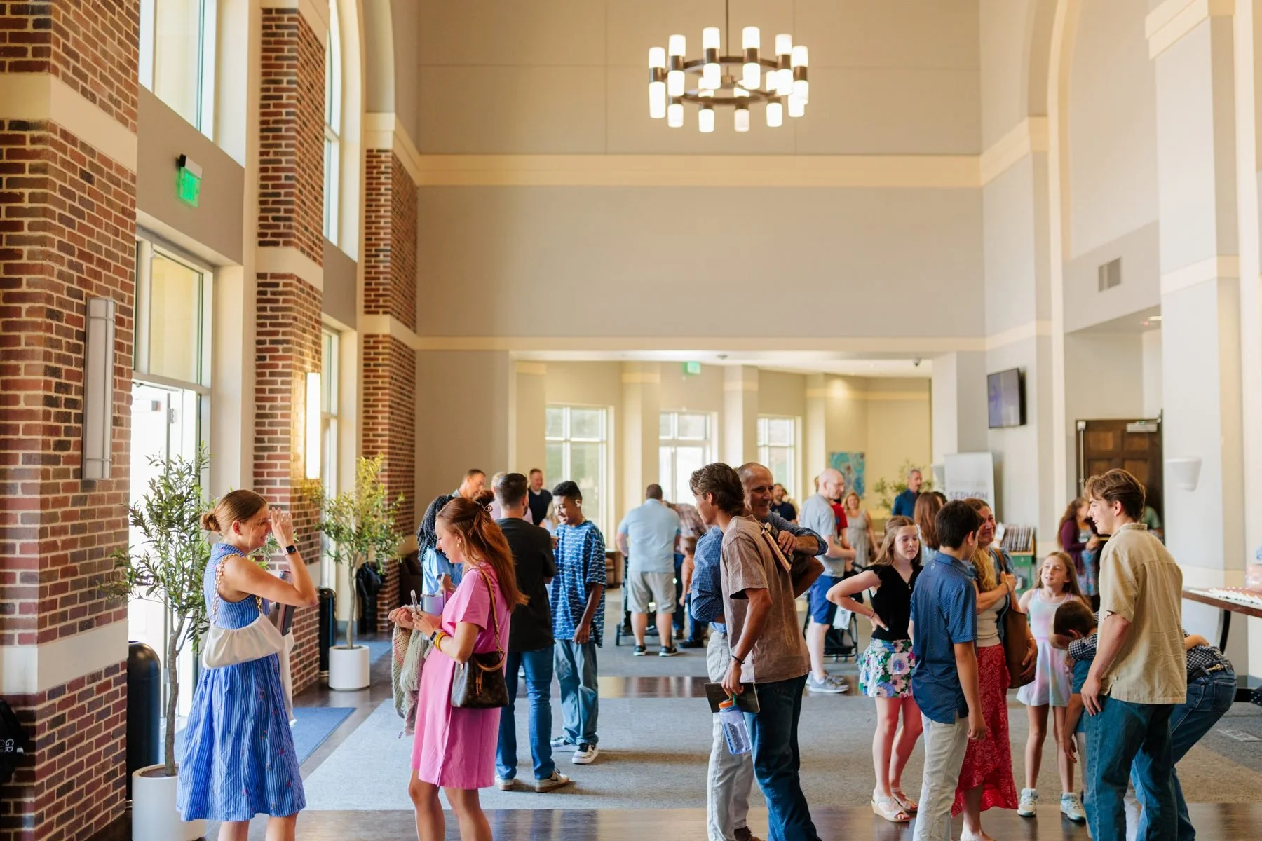 People gather and connect in the lobby at Grace Church Frisco