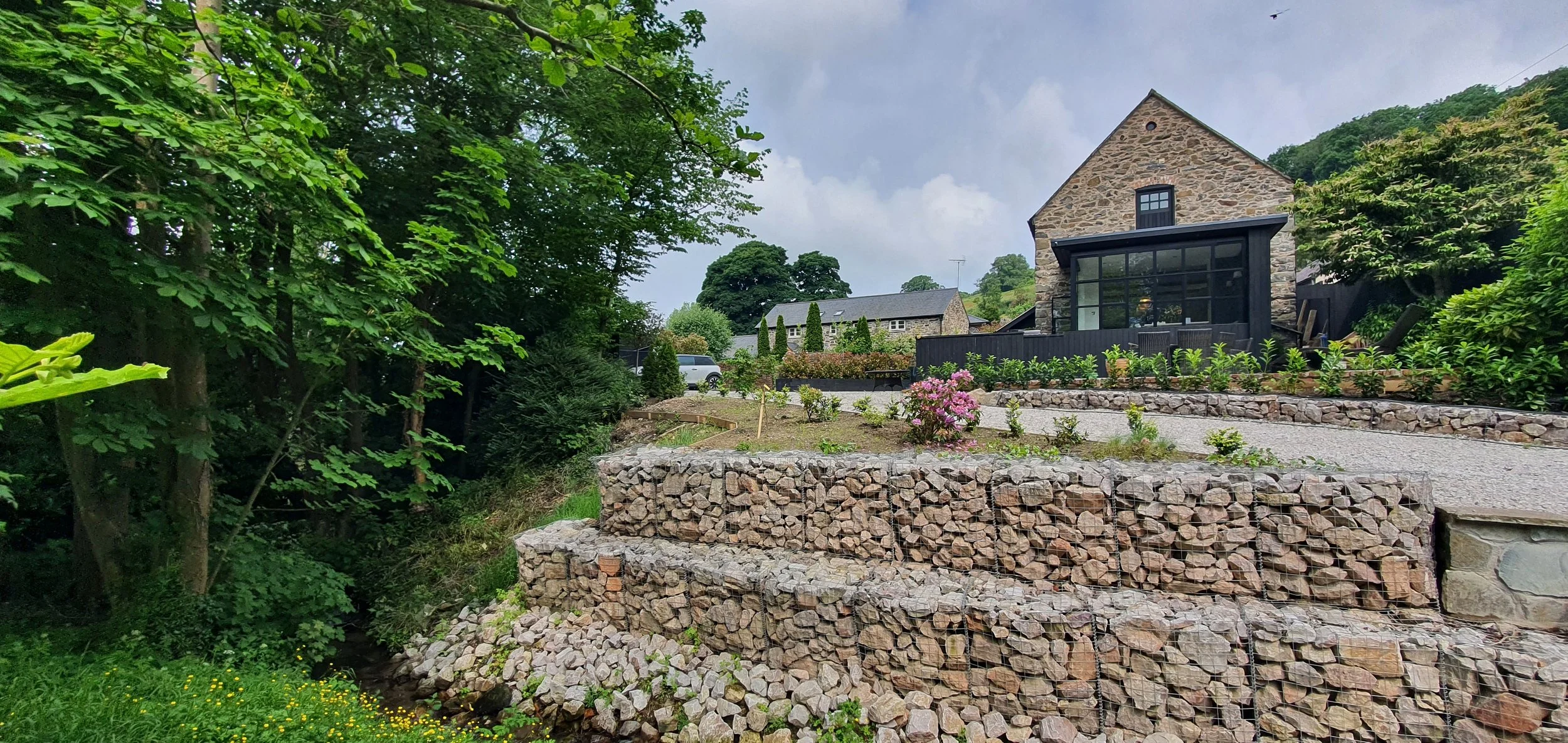 Garden design drawing in North Wales showing driveway over stream and retaining structure